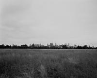 Melbourne CBD from Native Grass Circle, within construction zone. Silver gelatin photograph
